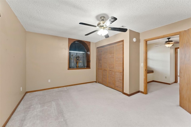 3310 Tall Timber Dr, Orlando, FL 32812 - unfurnished bedroom with carpet, a textured ceiling, a ceiling fan, and a closet