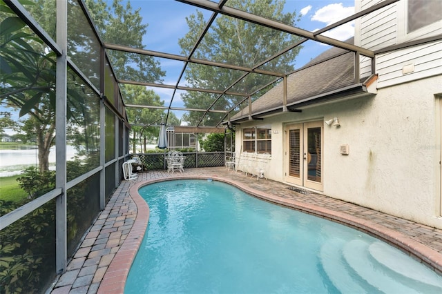 3310 Tall Timber Dr, Orlando, FL 32812 - swimming pool with french doors, a patio, and a water view
