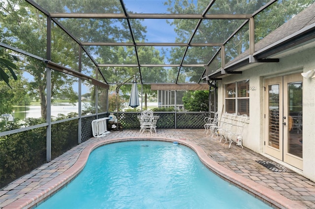 3310 Tall Timber Dr, Orlando, FL 32812 - swimming pool with a patio area, french doors, and a water view