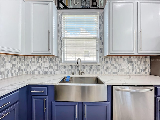238 Hunt St, Clermont, FL 34711 - kitchen featuring dishwasher, blue cabinetry, backsplash, and light stone counters