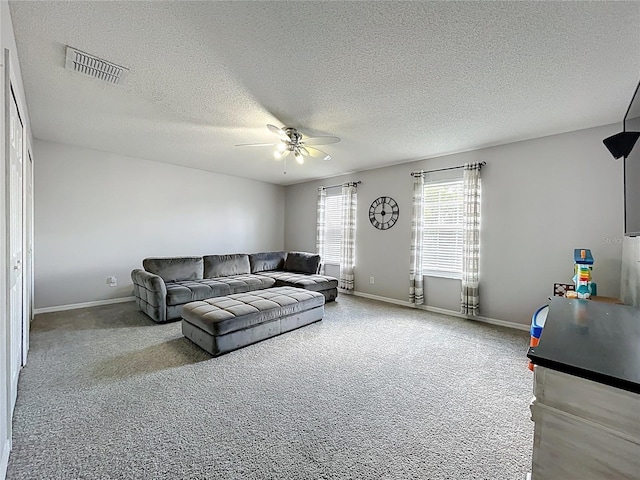 238 Hunt St, Clermont, FL 34711 - carpeted living area featuring ceiling fan and a textured ceiling