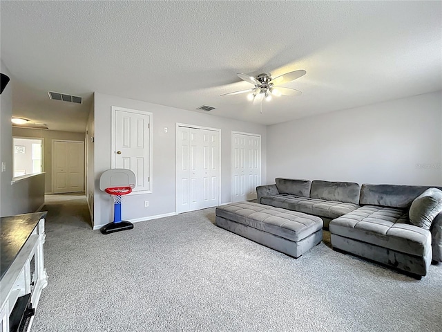 238 Hunt St, Clermont, FL 34711 - carpeted living room with a ceiling fan and a textured ceiling