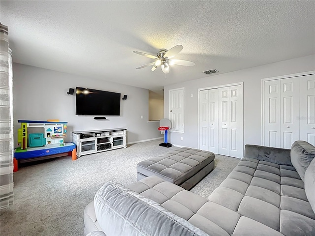 238 Hunt St, Clermont, FL 34711 - living area featuring carpet, ceiling fan, and a textured ceiling