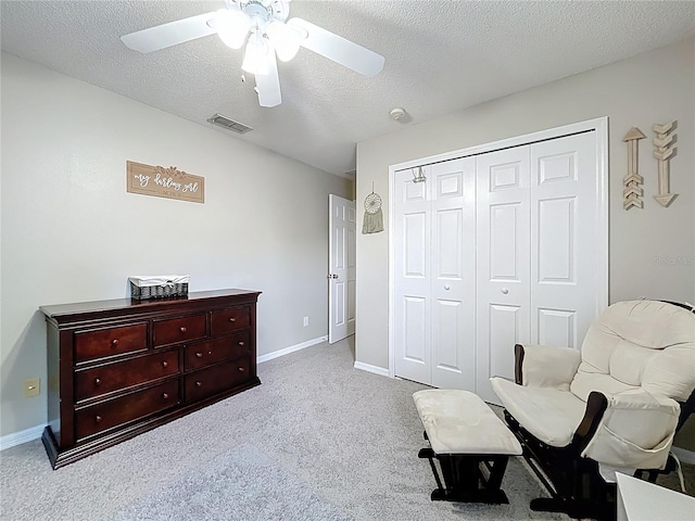 238 Hunt St, Clermont, FL 34711 - sitting room featuring a ceiling fan, carpet floors, and a textured ceiling