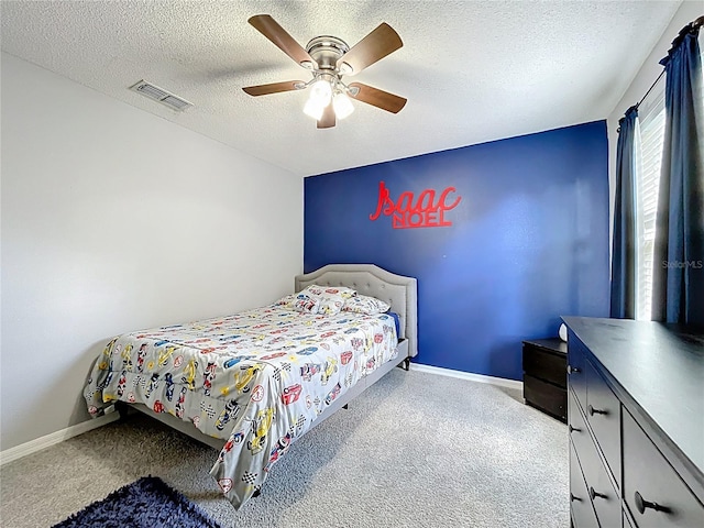238 Hunt St, Clermont, FL 34711 - carpeted bedroom with a ceiling fan and a textured ceiling
