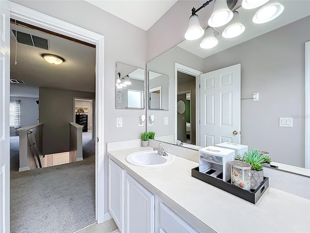 238 Hunt St, Clermont, FL 34711 - bathroom featuring vanity and a chandelier
