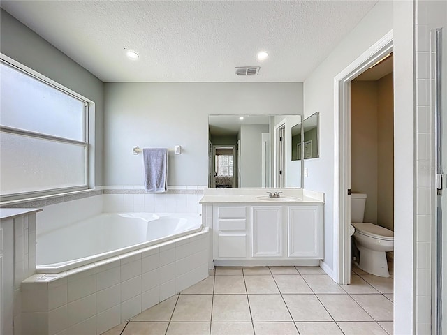 238 Hunt St, Clermont, FL 34711 - full bathroom with a bath, vanity, tile patterned floors, a textured ceiling, and recessed lighting