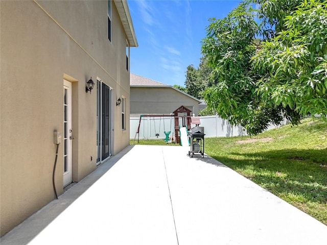 238 Hunt St, Clermont, FL 34711 - view of patio / terrace with a playground and area for grilling
