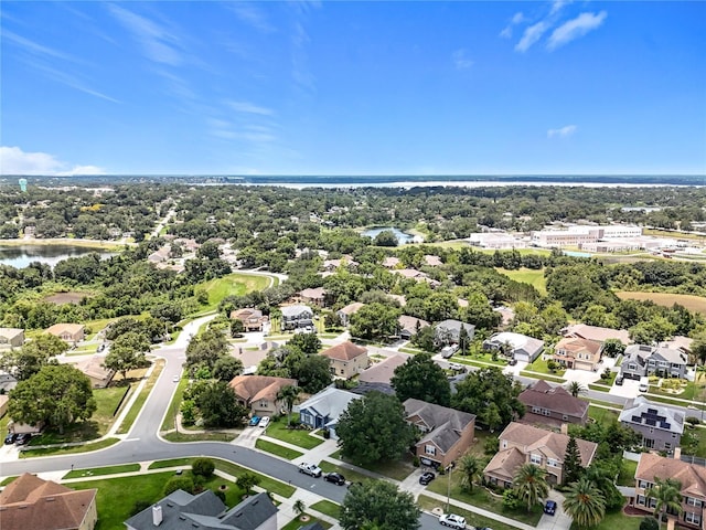 238 Hunt St, Clermont, FL 34711 - aerial perspective of suburban area with a nearby body of water and a tree filled landscape