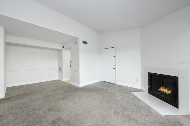 3700 Idlebrook Cir Unit 200, Casselberry, FL 32707 - unfurnished living room featuring carpet flooring and a fireplace