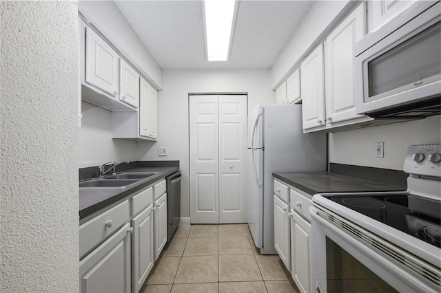 3700 Idlebrook Cir Unit 200, Casselberry, FL 32707 - kitchen featuring white electric range, white cabinetry, and dark countertops