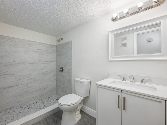 3700 Idlebrook Cir Unit 200, Casselberry, FL 32707 - full bath with a textured ceiling, vanity, tiled shower, and wood finished floors