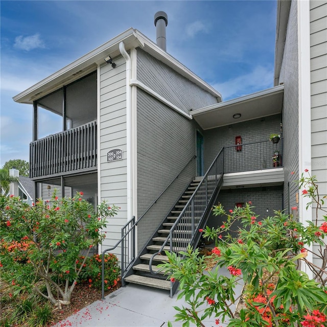 3700 Idlebrook Cir Unit 200, Casselberry, FL 32707 - view of property exterior with stairway and brick siding
