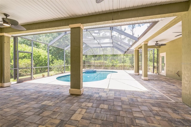 1818 W Cobblestone Ln, Saint Augustine, FL 32092 - view of swimming pool featuring ceiling fan, a patio area, a pool with connected hot tub, and glass enclosure