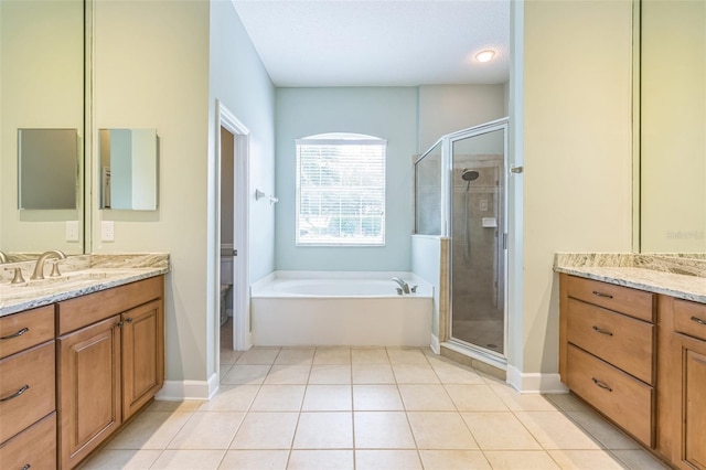 1818 W Cobblestone Ln, Saint Augustine, FL 32092 - full bath featuring vanity, a garden tub, and a stall shower