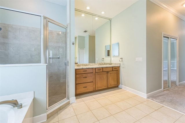 1818 W Cobblestone Ln, Saint Augustine, FL 32092 - full bathroom with vanity, a shower stall, a garden tub, tile patterned floors, and recessed lighting