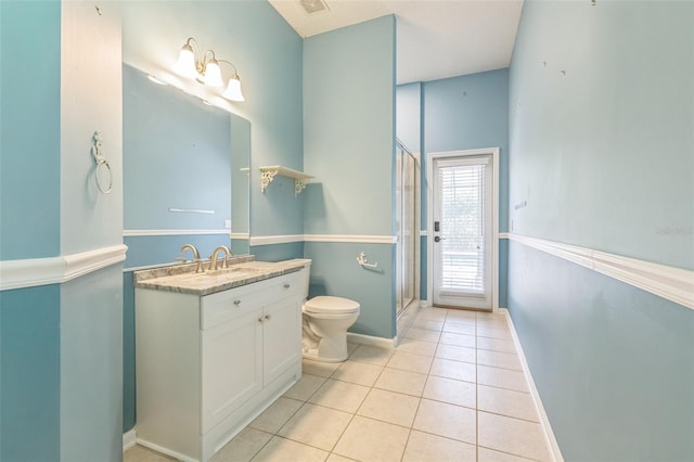 1818 W Cobblestone Ln, Saint Augustine, FL 32092 - full bathroom with vanity, tile patterned flooring, and a shower with door
