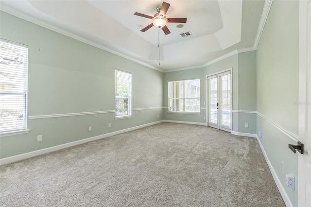 1818 W Cobblestone Ln, Saint Augustine, FL 32092 - spare room with a raised ceiling, a ceiling fan, carpet floors, and crown molding