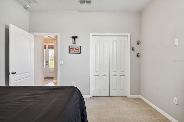 2433 Santa Vista Loop, Apopka, FL 32703 - bedroom featuring a closet and light carpet