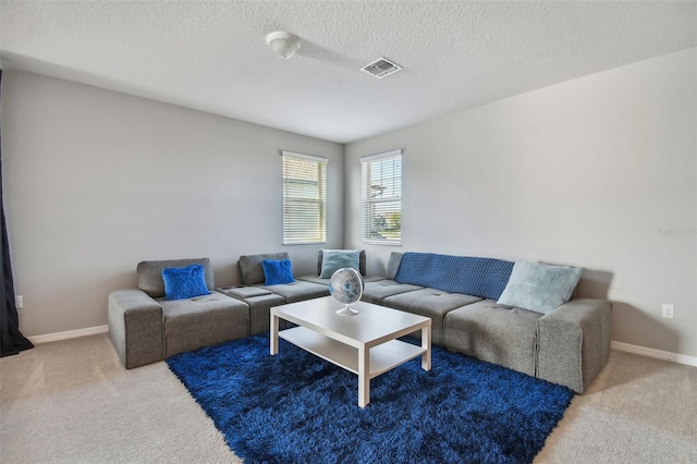 2433 Santa Vista Loop, Apopka, FL 32703 - carpeted living area featuring baseboards and a textured ceiling