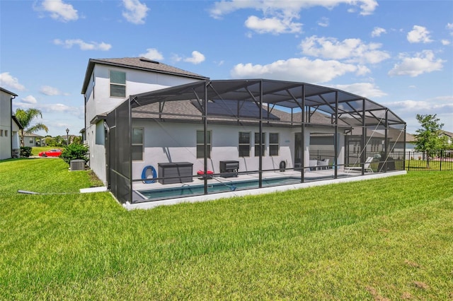 2433 Santa Vista Loop, Apopka, FL 32703 - rear view of house with stucco siding, a lanai, and a patio area