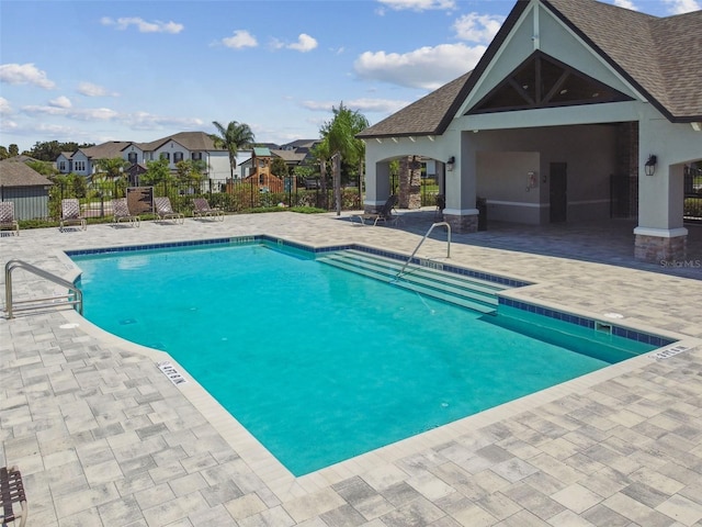 2433 Santa Vista Loop, Apopka, FL 32703 - community pool featuring a patio and a residential view