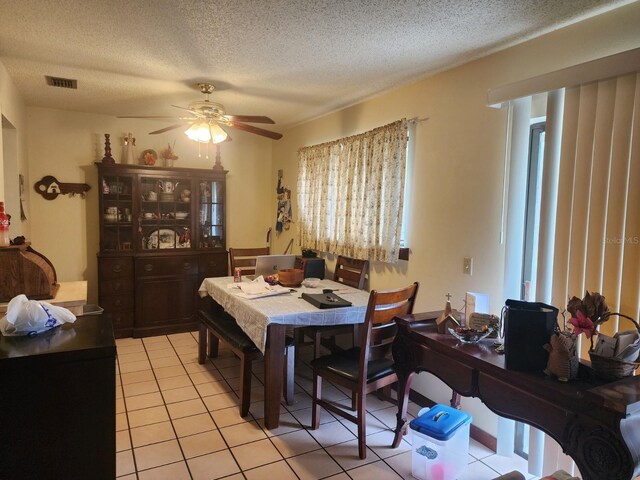 201 N Hart Rd, Geneva, FL 32732 - dining space featuring light tile patterned floors, ceiling fan, and a textured ceiling