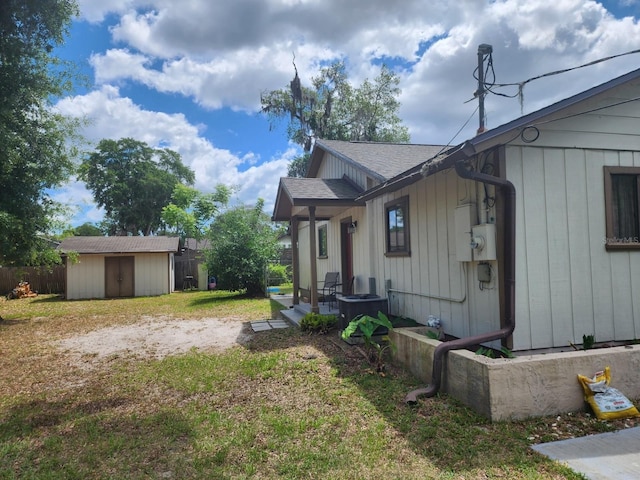 201 N Hart Rd, Geneva, FL 32732 - view of property exterior featuring a storage unit and a shingled roof