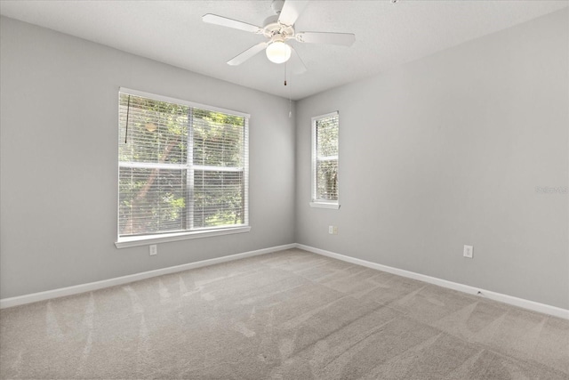 8842 Villa View Cir Unit 207, Orlando, FL 32821 - carpeted empty room with baseboards and a ceiling fan