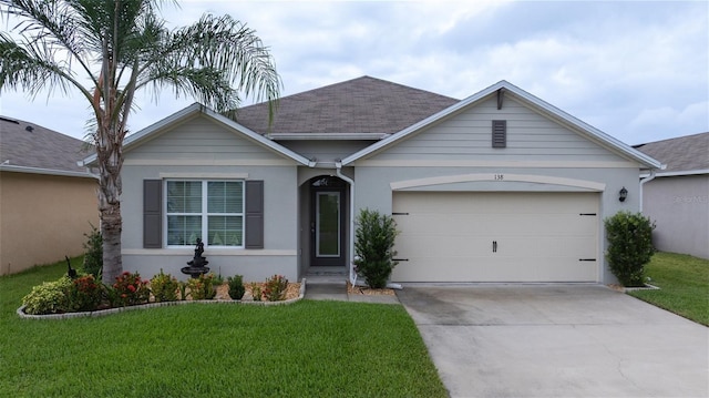 138 Old Mill Pond Rd, Edgewater, FL 32141 - ranch-style home featuring a front lawn, stucco siding, concrete driveway, and an attached garage