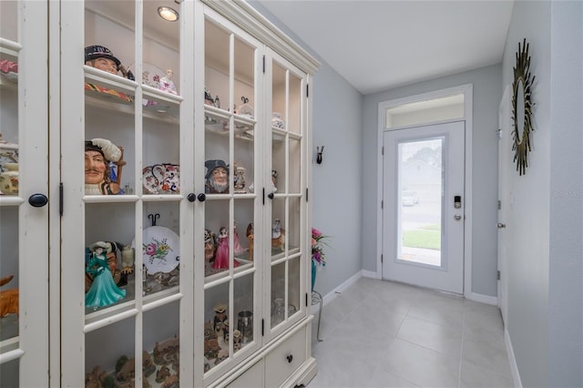 138 Old Mill Pond Rd, Edgewater, FL 32141 - doorway to outside featuring baseboards and light tile patterned flooring