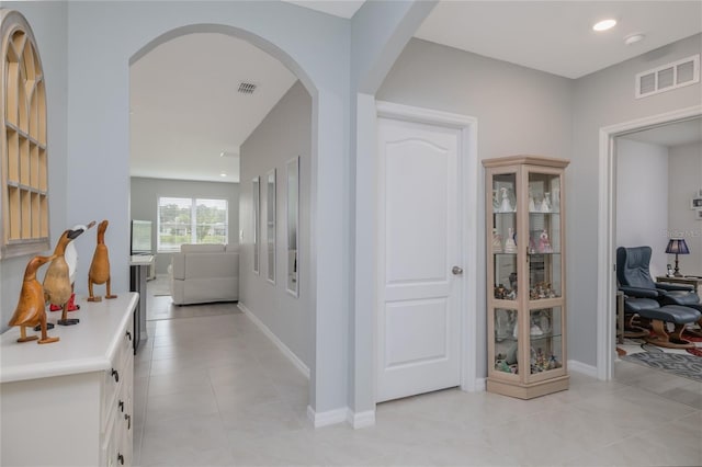 138 Old Mill Pond Rd, Edgewater, FL 32141 - hallway with arched walkways and light tile patterned floors