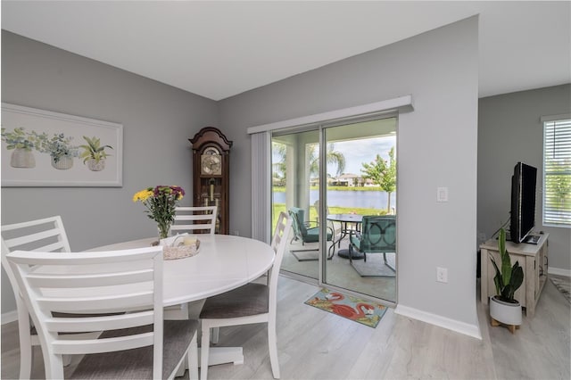 138 Old Mill Pond Rd, Edgewater, FL 32141 - dining room with light wood-style flooring and baseboards