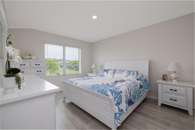 138 Old Mill Pond Rd, Edgewater, FL 32141 - bedroom with light wood-style flooring and lofted ceiling