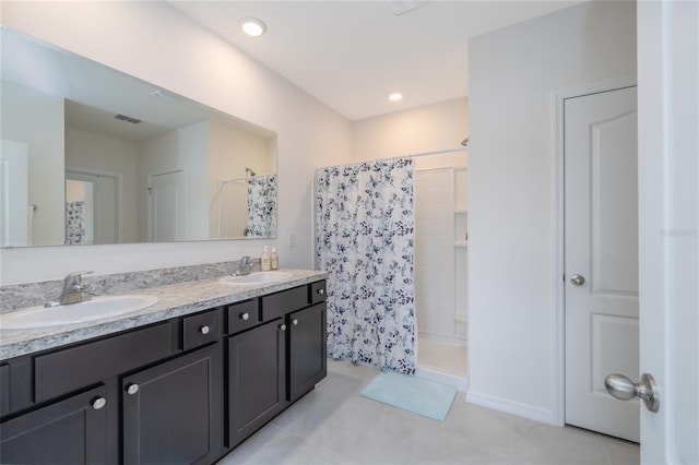 138 Old Mill Pond Rd, Edgewater, FL 32141 - full bathroom featuring tiled shower, double vanity, and tile patterned flooring