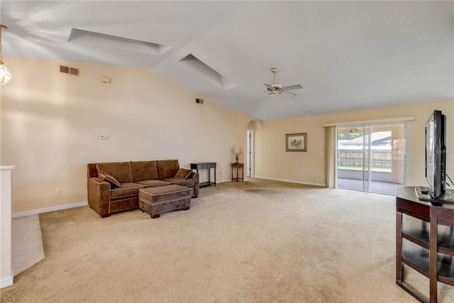 19 Potters Ln, Palm Coast, FL 32164 - living room with lofted ceiling, arched walkways, light colored carpet, and ceiling fan
