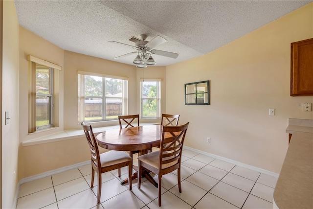 19 Potters Ln, Palm Coast, FL 32164 - dining space with a textured ceiling, a ceiling fan, and light tile patterned floors
