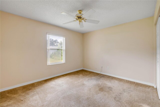 19 Potters Ln, Palm Coast, FL 32164 - unfurnished room featuring carpet floors, a ceiling fan, and a textured ceiling