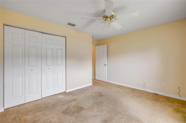 19 Potters Ln, Palm Coast, FL 32164 - unfurnished bedroom with carpet floors, a closet, ceiling fan, and a textured ceiling