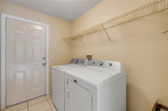 19 Potters Ln, Palm Coast, FL 32164 - washroom featuring washer and dryer and light tile patterned floors