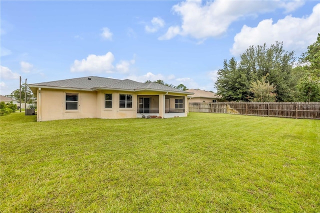 19 Potters Ln, Palm Coast, FL 32164 - rear view of house with stucco siding and a sunroom