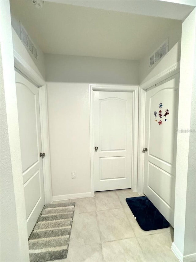 577 Talisi Loop, Saint Cloud, FL 34771 - mudroom with light tile patterned floors and baseboards