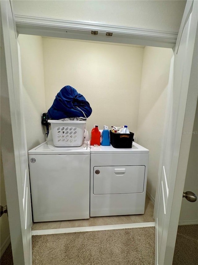 1314 Isleta Loop, Kissimmee, FL 34741 - washroom featuring separate washer and dryer and light carpet