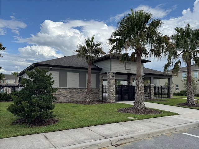 1314 Isleta Loop, Kissimmee, FL 34741 - prairie-style home with stone siding and roof with shingles
