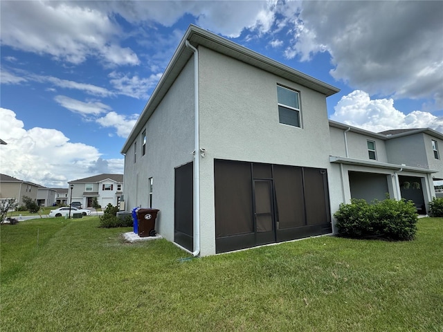 1314 Isleta Loop, Kissimmee, FL 34741 - rear view of property with stucco siding, a lawn, and a residential view