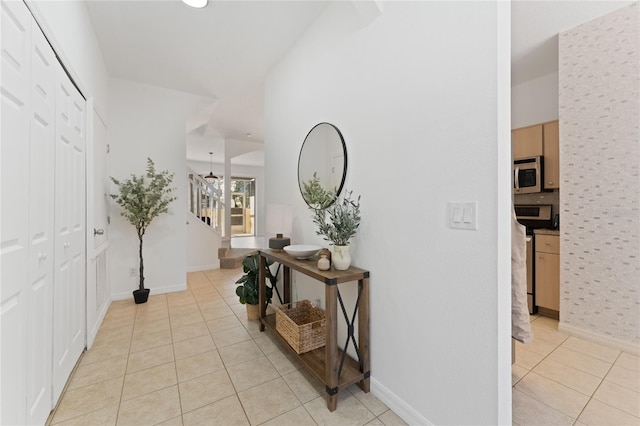 1176 S Beach Cir, Kissimmee, FL 34746 - hall featuring light tile patterned floors and stairs