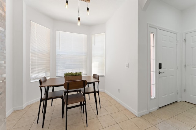 1176 S Beach Cir, Kissimmee, FL 34746 - dining room with light tile patterned floors and arched walkways