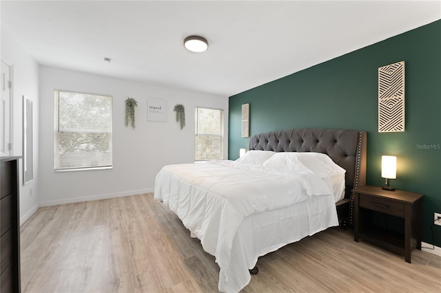 1176 S Beach Cir, Kissimmee, FL 34746 - bedroom with multiple windows and light wood-style flooring
