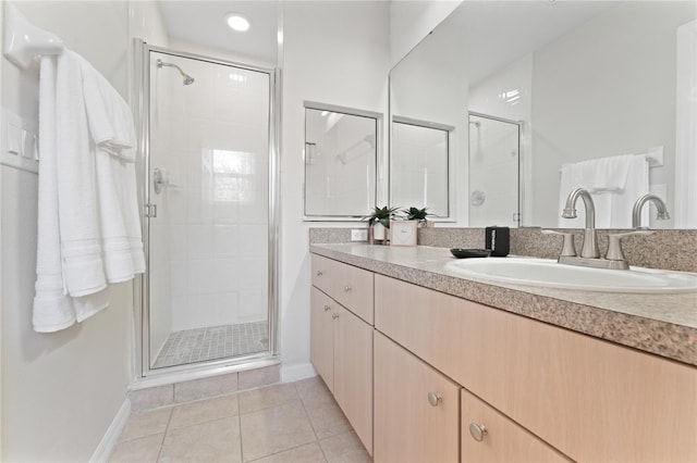 1176 S Beach Cir, Kissimmee, FL 34746 - bathroom with a shower stall, vanity, and tile patterned floors