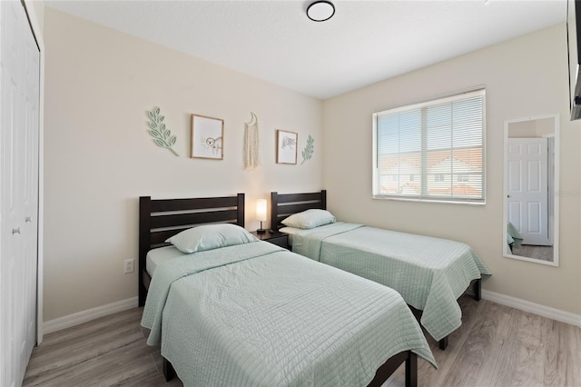 1176 S Beach Cir, Kissimmee, FL 34746 - bedroom with wood finished floors and baseboards